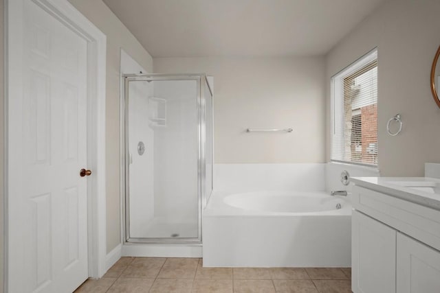 bathroom featuring tile patterned flooring, vanity, and independent shower and bath