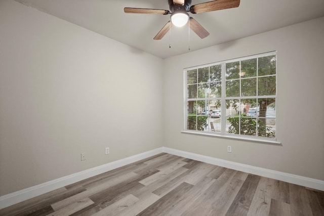 spare room featuring ceiling fan and light hardwood / wood-style floors