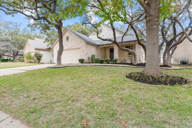 151 Dan Moody Trl, Georgetown, TX 78633 - view of front of property with stone siding, concrete driveway, an attached garage, and a front yard