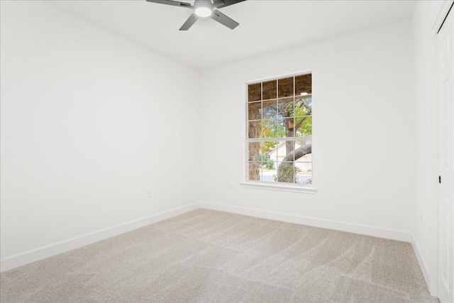 spare room with carpet flooring and ceiling fan