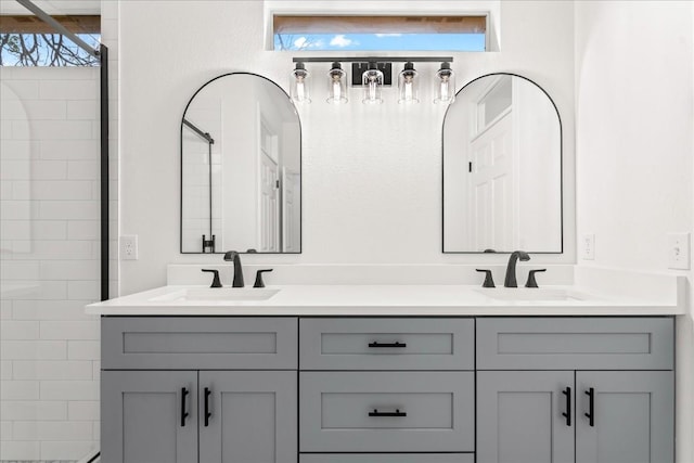 151 Dan Moody Trl, Georgetown, TX 78633 - bathroom with double vanity and tiled shower