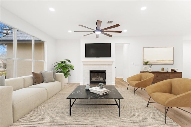 151 Dan Moody Trl, Georgetown, TX 78633 - living area with ceiling fan, light wood-style floors, a fireplace, and recessed lighting