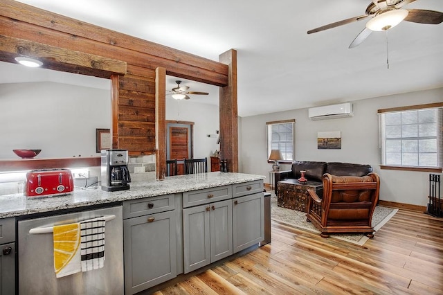 9475 N US Highway 377, Junction, TX 76849 - kitchen featuring a wall unit AC, gray cabinets, a ceiling fan, beverage cooler, and healthy amount of natural light
