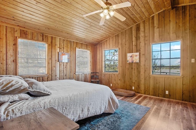 bedroom with ceiling fan, wood-type flooring, wood ceiling, and vaulted ceiling