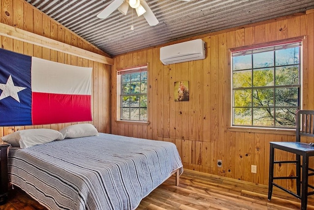 bedroom featuring ceiling fan, an AC wall unit, wood-type flooring, vaulted ceiling, and wood ceiling