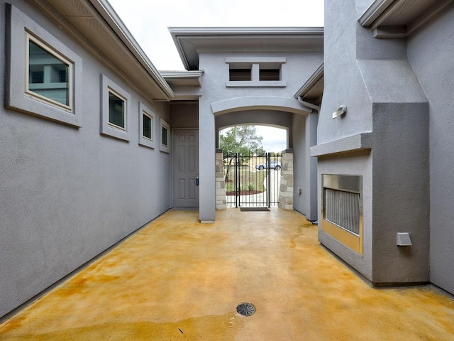 19516 Tranquility Falls Path, Lago Vista, TX 78645 - property entrance featuring stucco siding and a gate