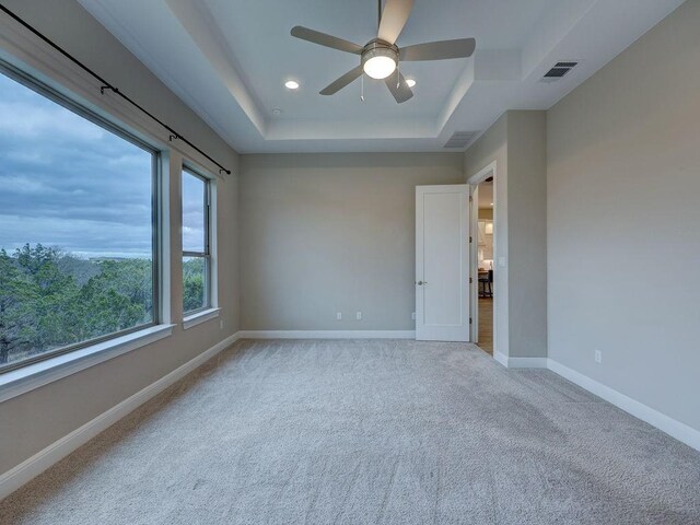 19516 Tranquility Falls Path, Lago Vista, TX 78645 - empty room with a tray ceiling, ceiling fan, carpet flooring, and recessed lighting