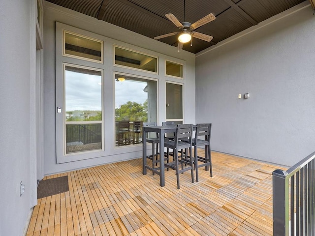 exterior space featuring ceiling fan and wood ceiling