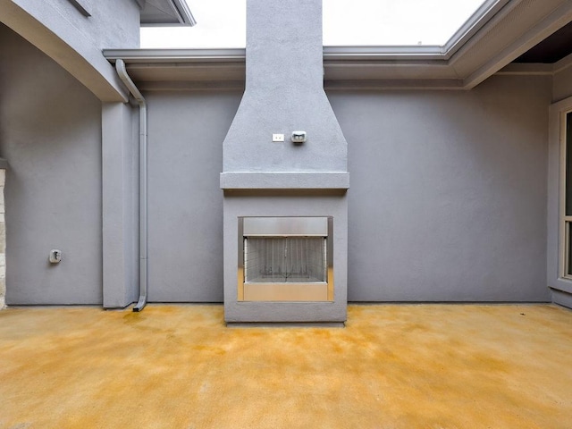 19516 Tranquility Falls Path, Lago Vista, TX 78645 - exterior view of stucco siding and a fireplace