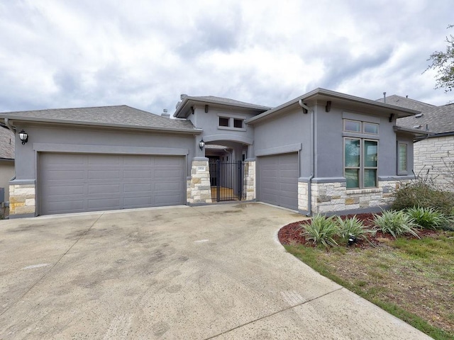 19516 Tranquility Falls Path, Lago Vista, TX 78645 - prairie-style home with stone siding, stucco siding, concrete driveway, and a garage