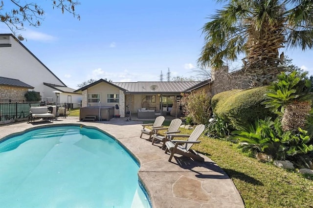 view of pool featuring a patio and a hot tub