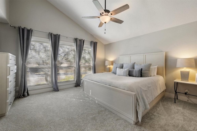 bedroom with ceiling fan, high vaulted ceiling, and light colored carpet