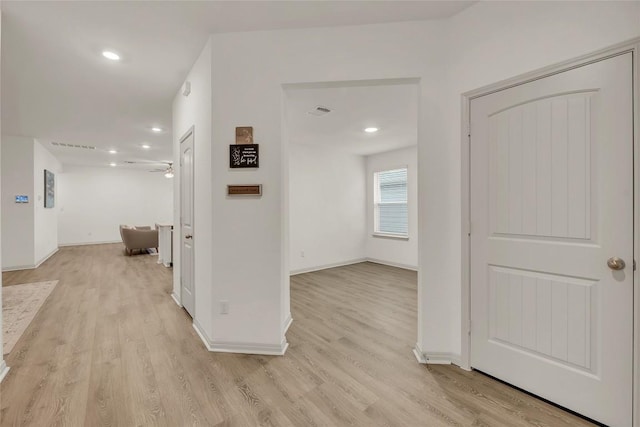 hall with light wood-type flooring