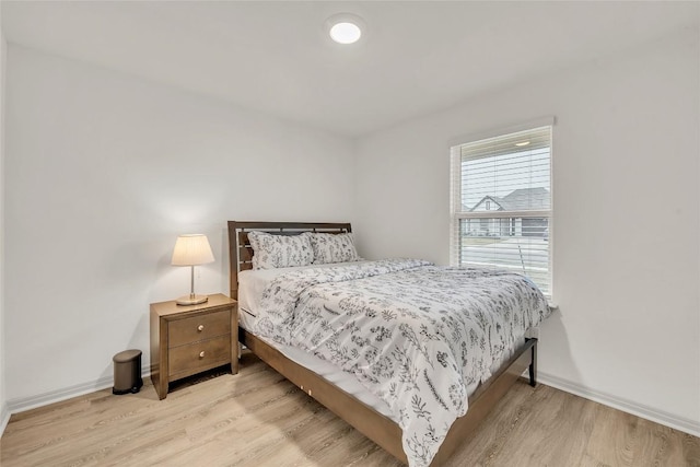 bedroom with light hardwood / wood-style flooring