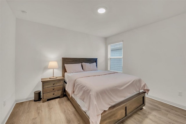 bedroom with light hardwood / wood-style floors