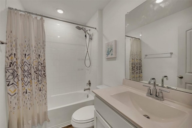 full bathroom featuring vanity, shower / bathtub combination with curtain, and toilet