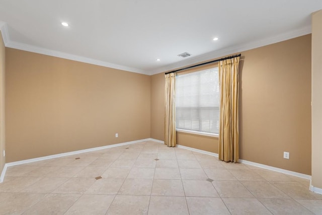 tiled empty room featuring crown molding