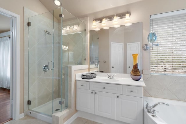 bathroom with separate shower and tub, tile patterned floors, and vanity