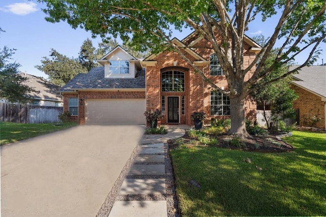 front of property with a garage and a front lawn