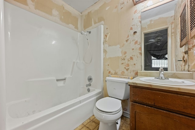 full bathroom with vanity, toilet, and  shower combination