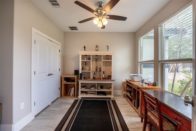 dining room with ceiling fan and light hardwood / wood-style flooring