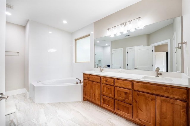 bathroom with a bathtub and vanity