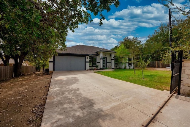 view of front facade featuring a garage and a front yard