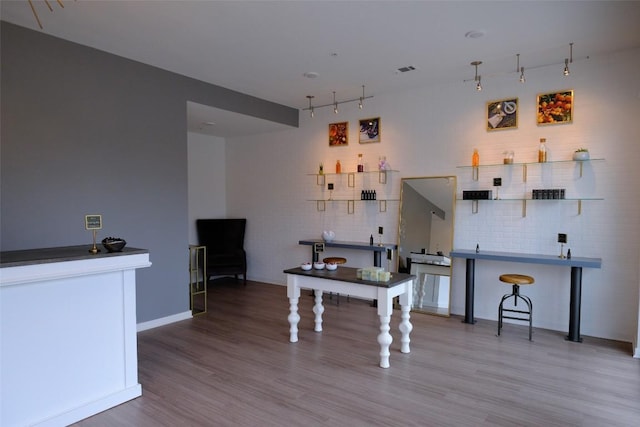 4361 S Congress Ave Unit 106, Austin, TX 78745 - kitchen with wood finished floors and track lighting