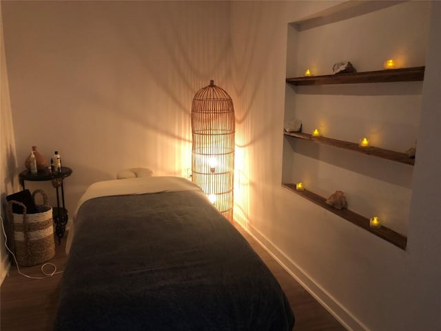 4361 S Congress Ave Unit 106, Austin, TX 78745 - bedroom with dark wood-type flooring and baseboards