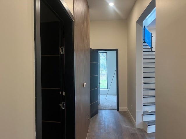 hallway with dark wood-type flooring