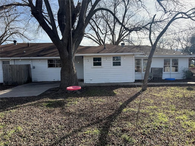 back of property with a patio area