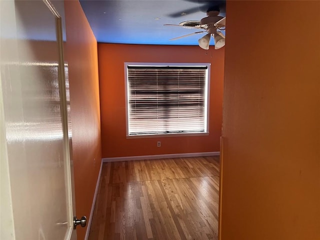 spare room featuring ceiling fan and light hardwood / wood-style flooring