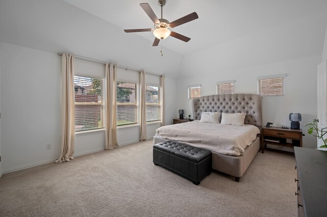 carpeted bedroom featuring lofted ceiling and ceiling fan