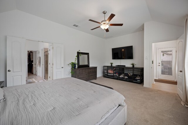 carpeted bedroom with ceiling fan and lofted ceiling