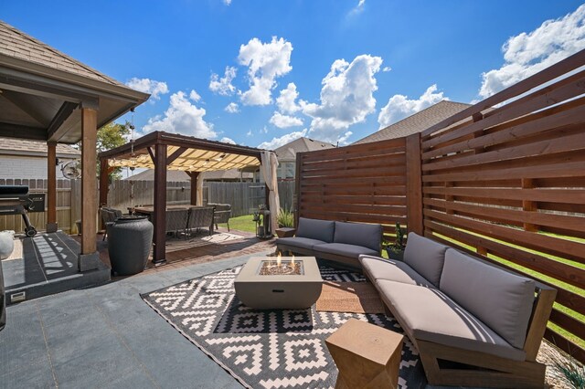 view of patio / terrace featuring an outdoor living space with a fire pit and a pergola