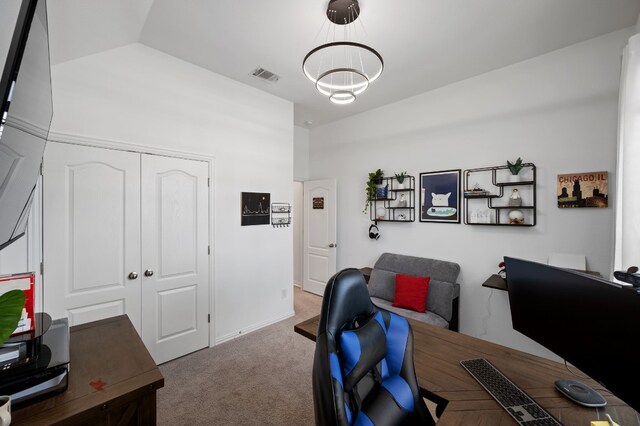 office space featuring vaulted ceiling, carpet floors, and a chandelier