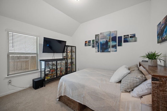 carpeted bedroom featuring vaulted ceiling