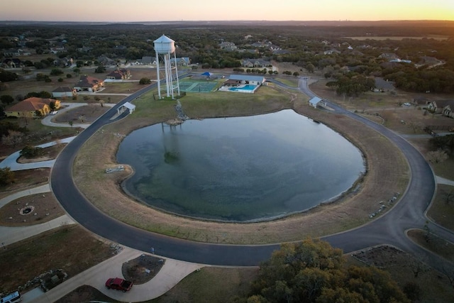 aerial view at dusk with a water view