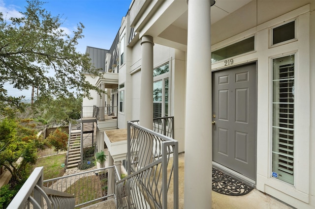 view of exterior entry with covered porch