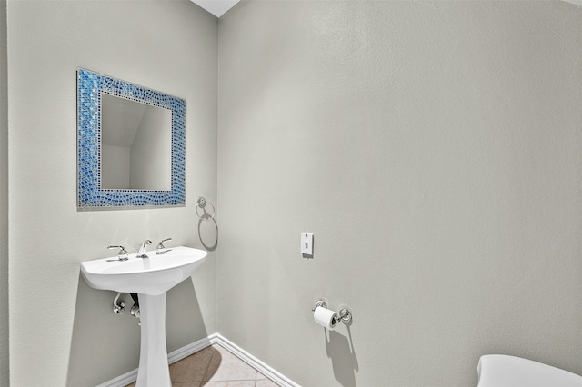 bathroom featuring tile patterned flooring and sink