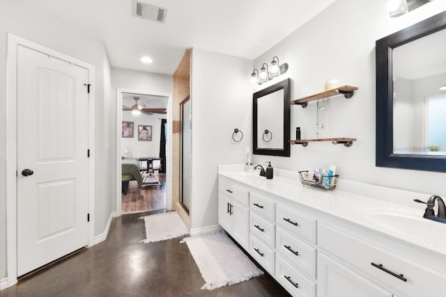 bathroom featuring vanity, ceiling fan, concrete floors, and a shower with shower door