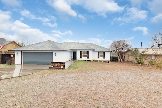 ranch-style home featuring a garage