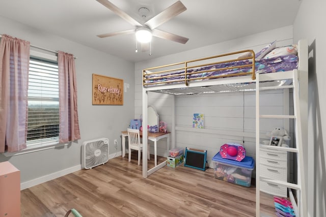 bedroom featuring hardwood / wood-style flooring and ceiling fan