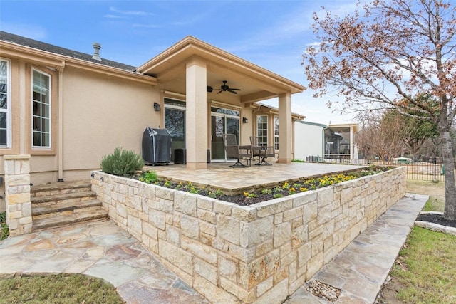 view of patio with grilling area and ceiling fan