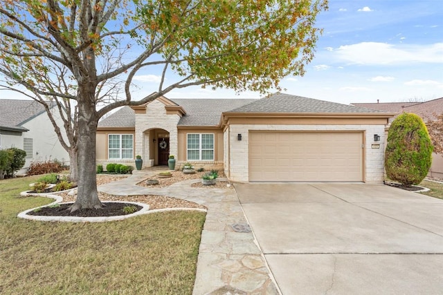 view of front of house with a garage and a front yard