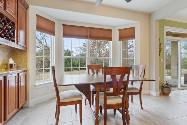 dining room featuring ceiling fan and light tile patterned floors