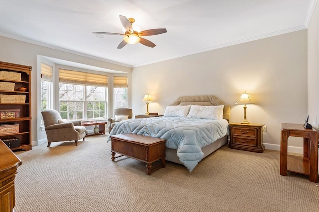 bedroom with ceiling fan, crown molding, and light carpet