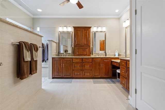 bathroom with vanity, ceiling fan, and ornamental molding