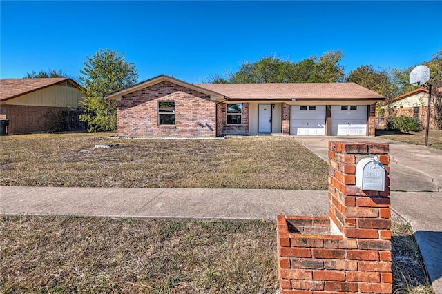 single story home with a garage and a front lawn