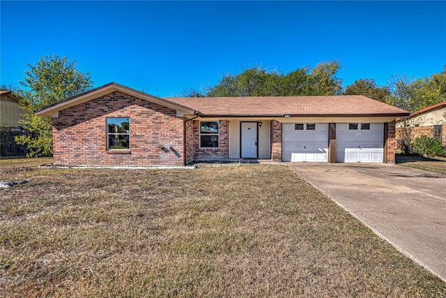 ranch-style house featuring a garage and a front lawn